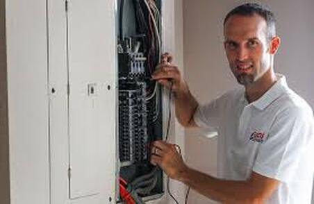 Electrician fixing fuse box 