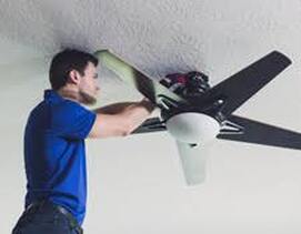 Man installing ceiling fan